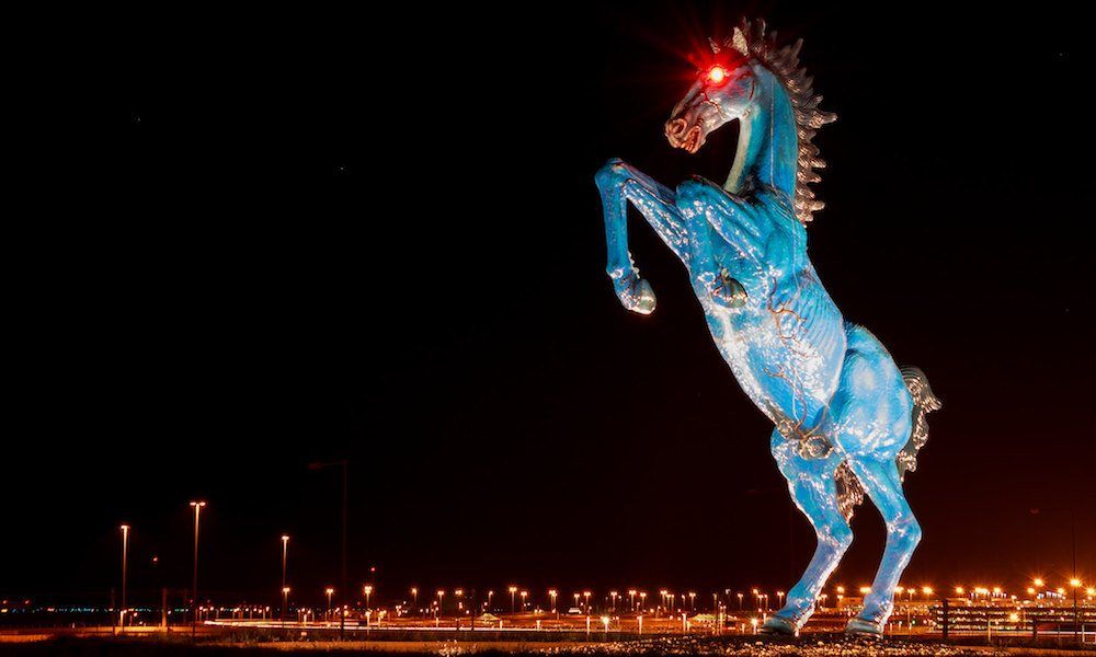 Blue Mustang statue at Denver International Airport -- a large blue mustang, rearing, with glowing red eyes