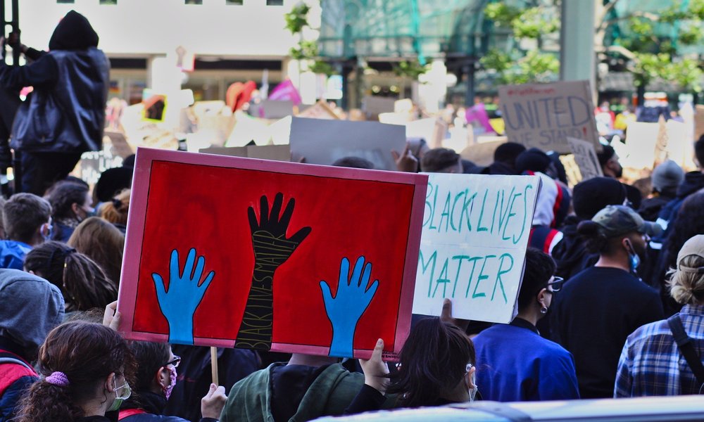 Black Lives Matter protesters holding signs, 2020