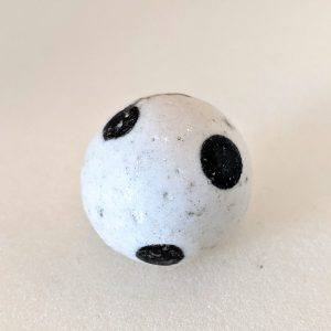 White spotted dick marble with 6 black polka dots.  Nice large size for an unusual marble.