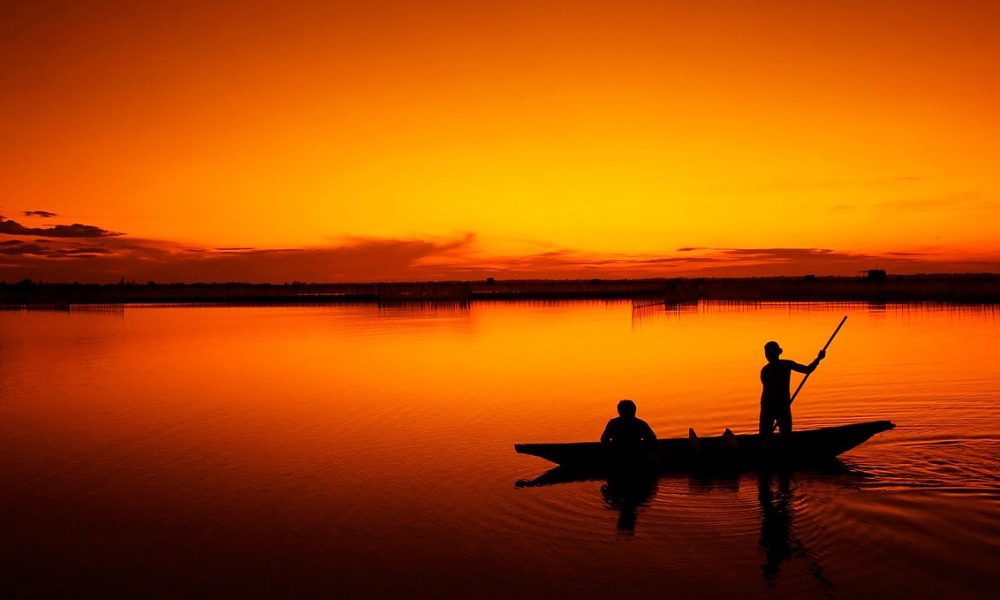 Boat in front of sunset