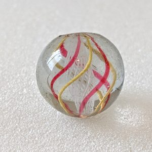 White nicely formed latticino core with 3 jelly red alternating w/ 3 opaque yellow outer ribbons. Faceted pontil